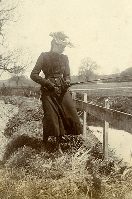 A sepia image of a woman angling